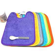 Babero rizo con goma plastificado. Colores vivos-